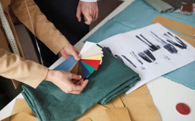 Close-up of designers choosing color of fabric for their future fashion collection of clothes